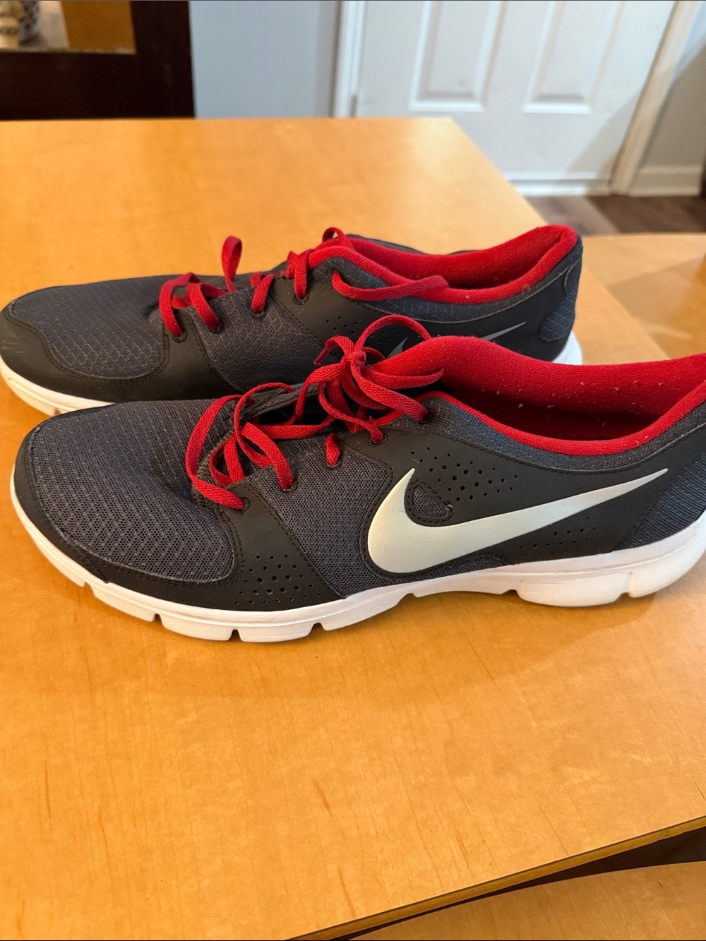 Nike Black Shoes with Red Accents and White Swoosh